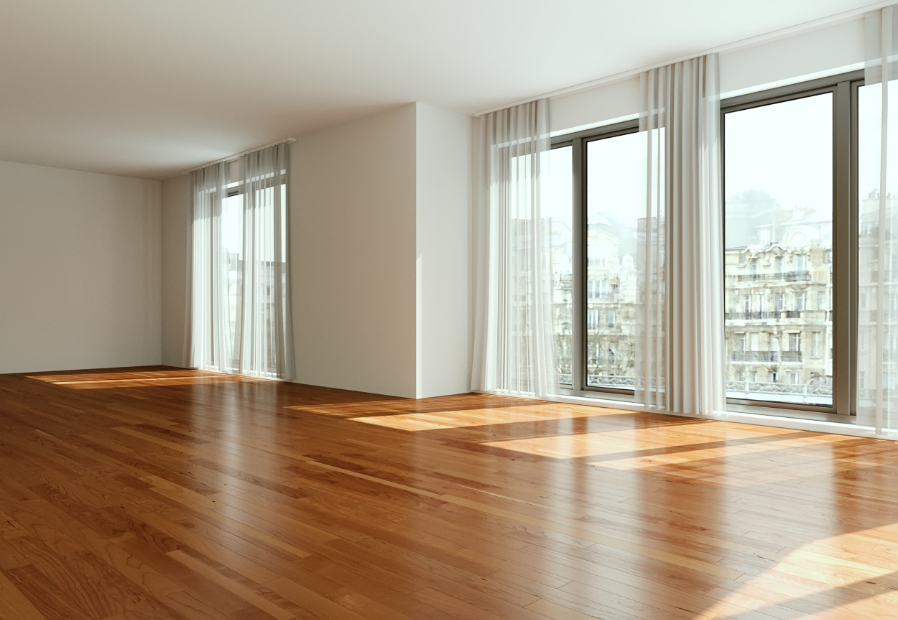 Salon d’un appartement vide, moderne et lumineux avec vue sur Paris