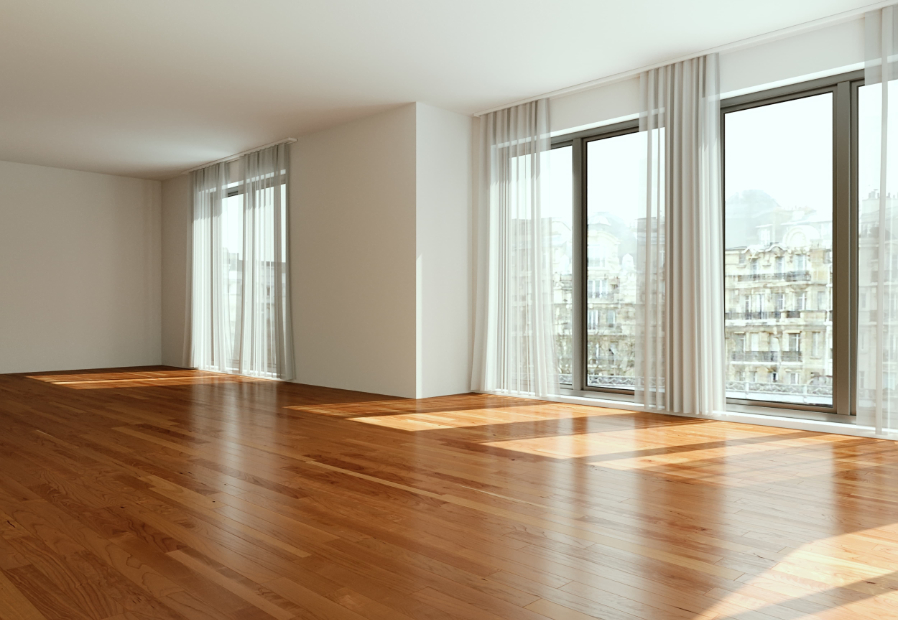 Living room of a modern and bright unfurnished apartment with a view of Paris